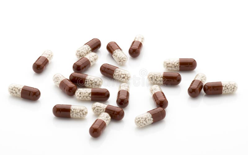 Antibiotic capsules on a white background.