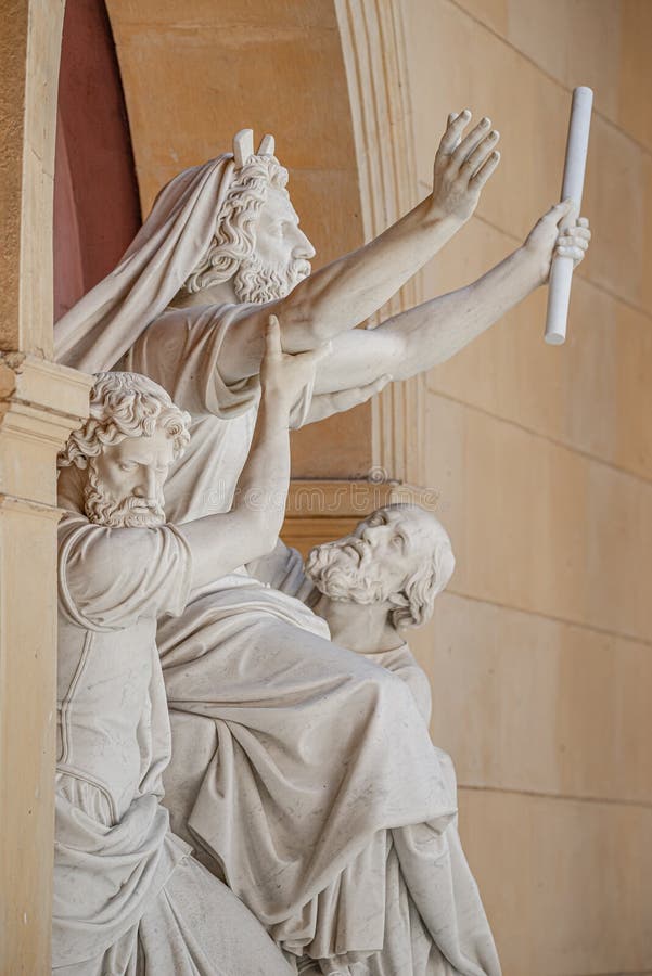 Old statue with prophets in Judaism Moses, Aaron and Hur at the old Church of Peace Friedenskirche, located at Sanssouci City Park entrance in Potsdam, Germany. Old statue with prophets in Judaism Moses, Aaron and Hur at the old Church of Peace Friedenskirche, located at Sanssouci City Park entrance in Potsdam, Germany.