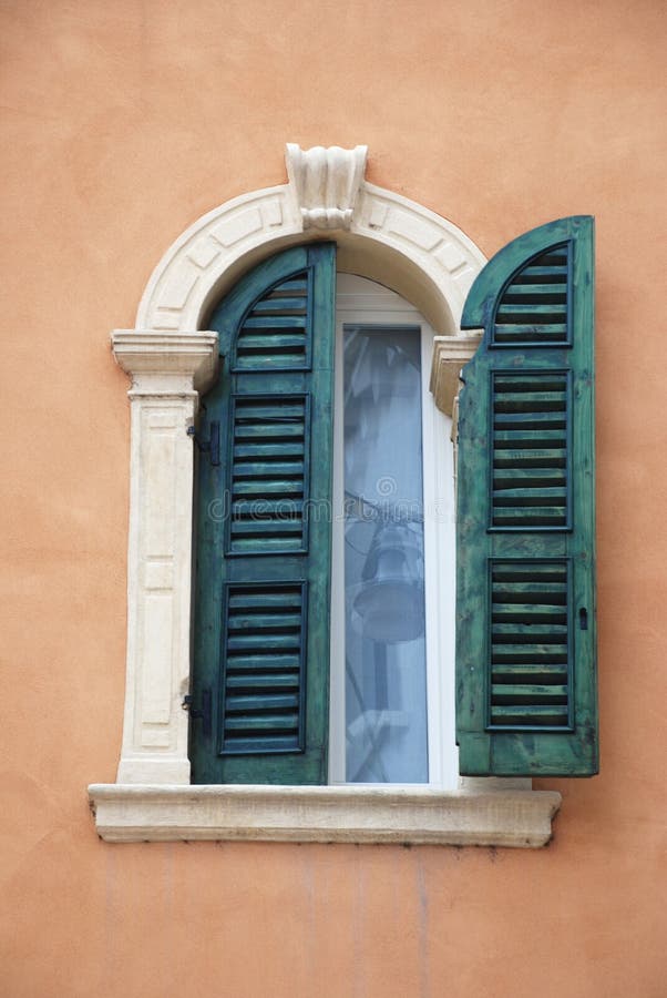 Antique window with green shutters from Verona (Italy). Antique window with green shutters from Verona (Italy).