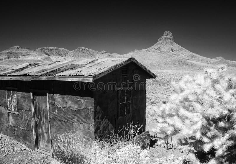 Old shed sits along historic Route 66 in the Black Mountains of western Arizona, infrared . Old shed sits along historic Route 66 in the Black Mountains of western Arizona, infrared