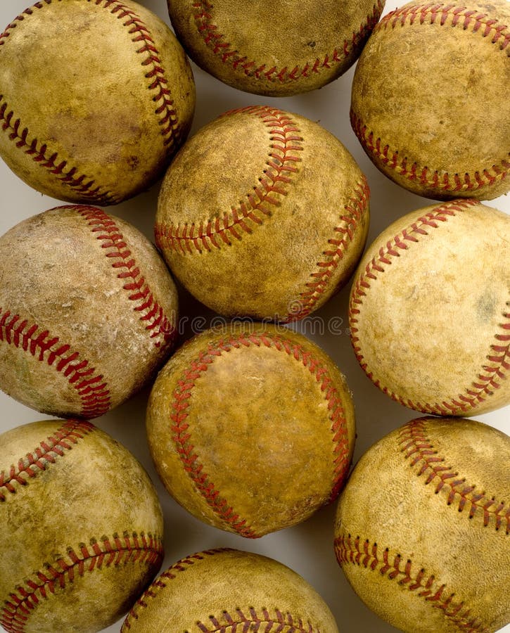 A background of vintage, antique, old baseballs on a white background with copy space. A background of vintage, antique, old baseballs on a white background with copy space