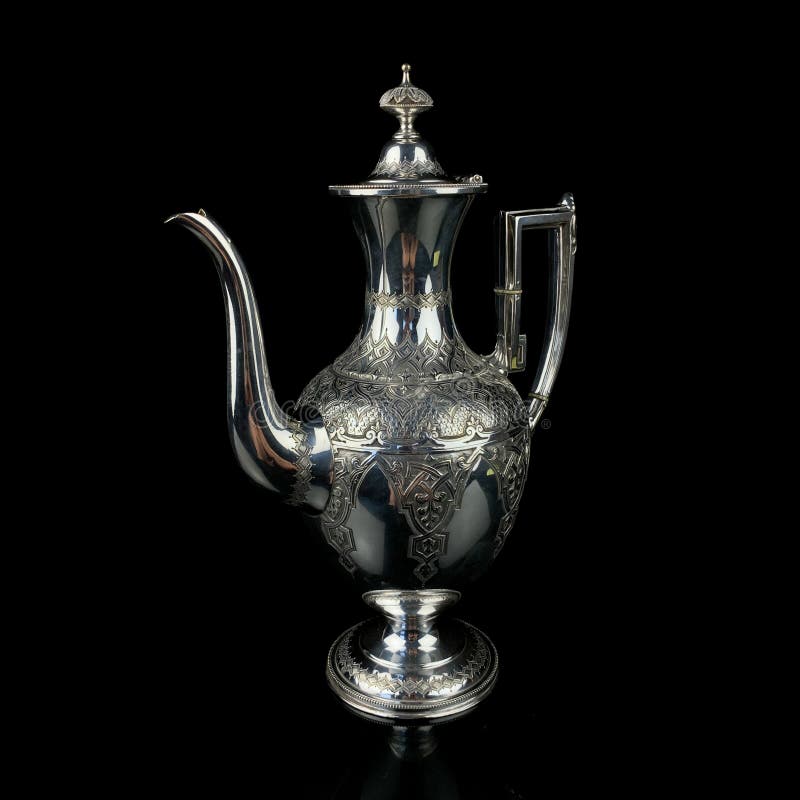 Antique arabic metal teapot with national patterns. metal israeli teapot on black isolated background. Antique arabic metal teapot with national patterns. metal israeli teapot on black isolated background