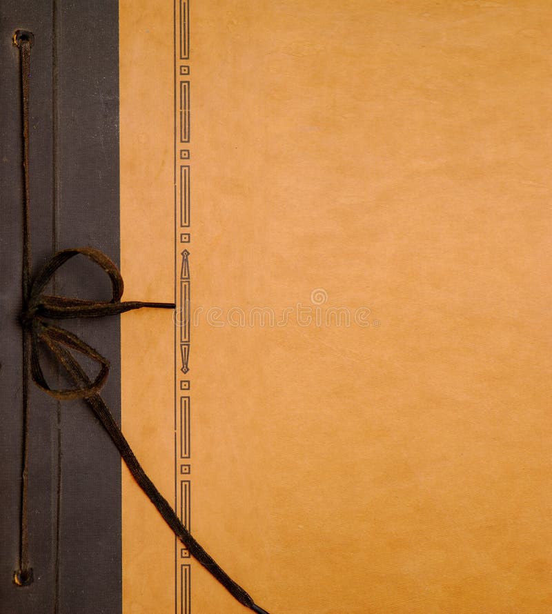 Antique photo album cover with string tie for binding. Antique photo album cover with string tie for binding