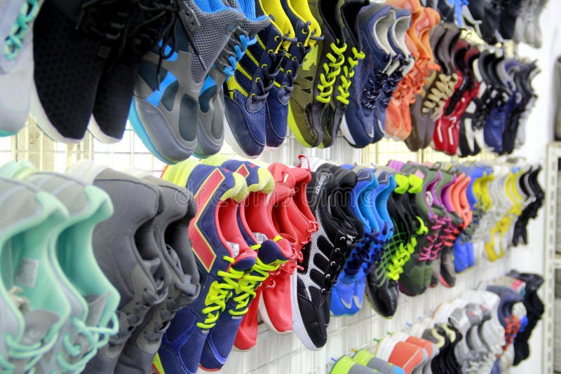 Assorted Used Rubber Shoes on Display at a Used Clothing and Cookware ...