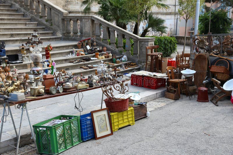 ALTAMURA, ITALY - JUNE 4, 2017: Flea market products in Altamura, Italy. Variety of trinket and antique furniture. ALTAMURA, ITALY - JUNE 4, 2017: Flea market products in Altamura, Italy. Variety of trinket and antique furniture