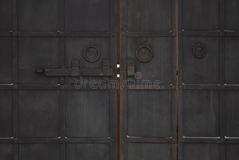 Antique Black Metal Gate with a Large Deadbolt Stock Image Image of