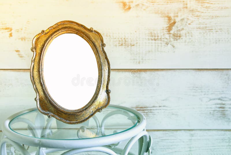 Antique blank vintage style frame on vintage table. template, ready to put photography. vintage filtered stock photo Antique blank vintage style frame on vintage table. template, ready to put photography. vintage filtered stock photo