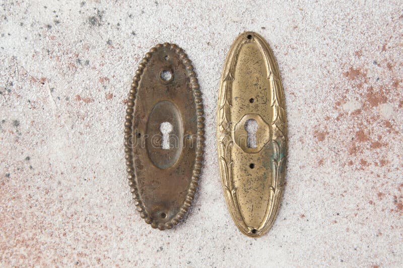 Antique brass keyhole lock covers stock images
