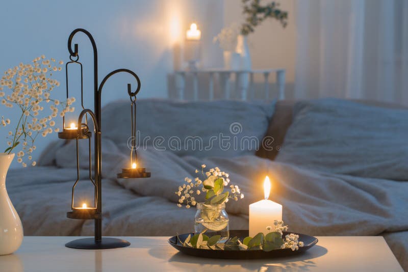 Antique Candlestick with Burning Candle on Wooden Table on Background
