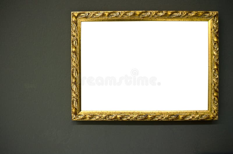 Antique empty golden frame on grunge wall