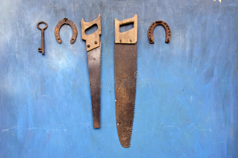 Antique garden and farm tools on old wooden wall royalty free stock photography Antique garden and farm tools on old wooden wall royalty free stock photography