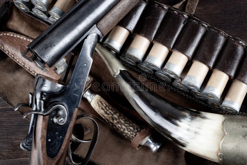 Antique 12 gauge break action smooth bored double barreled shotgun with paper cases stock images