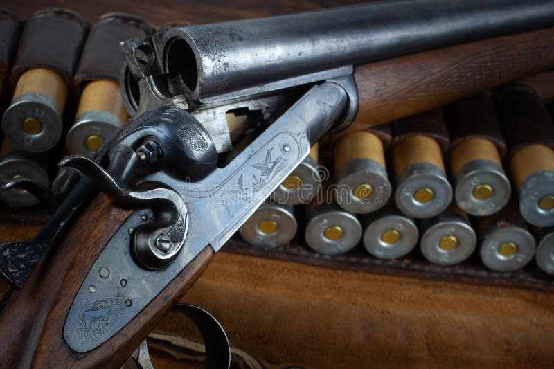 Antique 12 gauge break action smooth bored double barreled shotgun with paper cases royalty free stock photos