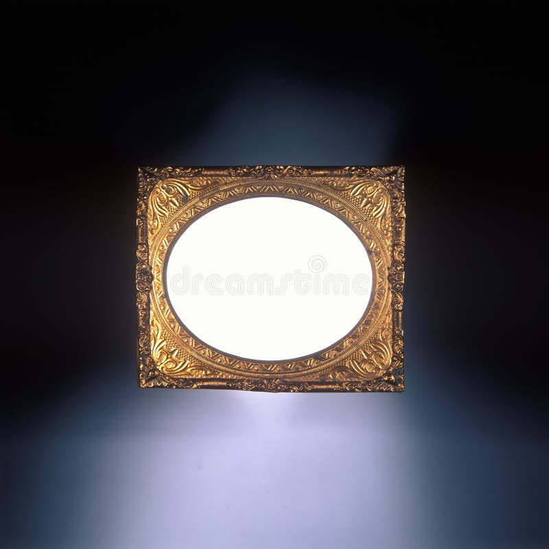 Antique golden daguerreotype picture frame with blank oval insert for future image placement. Antique golden daguerreotype picture frame with blank oval insert for future image placement