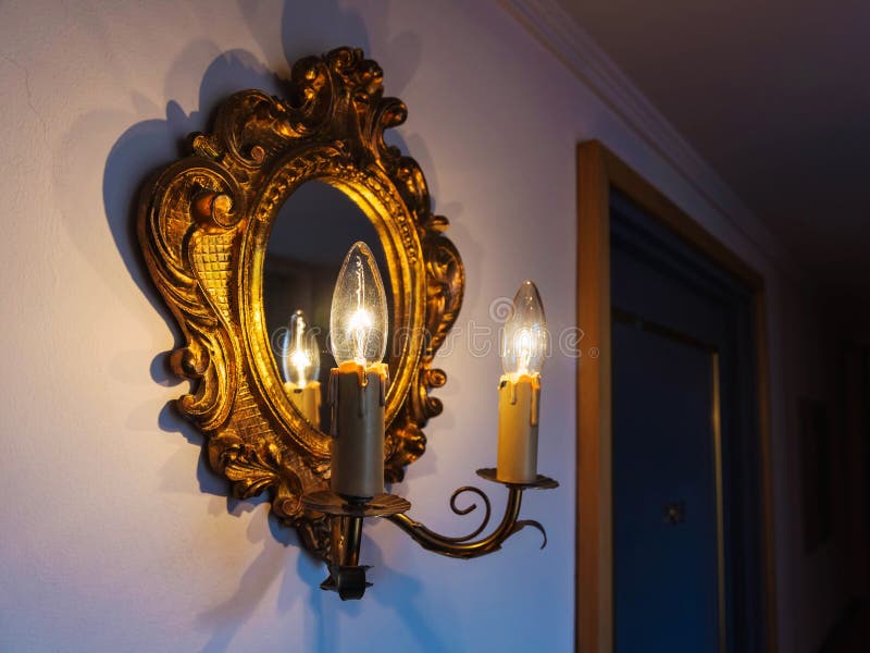 Antique lamp and mirror stock photo. Image of bright 70906794