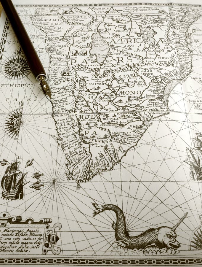 Romantic trips concept - A photograph of a beautiful old ancient map of Africa taken with an antique calligraphic writing pen. Map details with sea creatures and monsters, old style antiques sailing ships and compass rose. Vertical color detailed photo, nobody in picture. Adventure trip and explore travel theme concept. Romantic trips concept - A photograph of a beautiful old ancient map of Africa taken with an antique calligraphic writing pen. Map details with sea creatures and monsters, old style antiques sailing ships and compass rose. Vertical color detailed photo, nobody in picture. Adventure trip and explore travel theme concept.