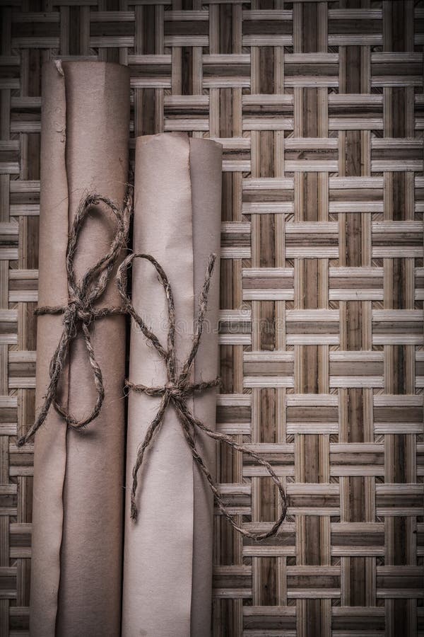 Antique medieval parchment on wicker wooden stock photos