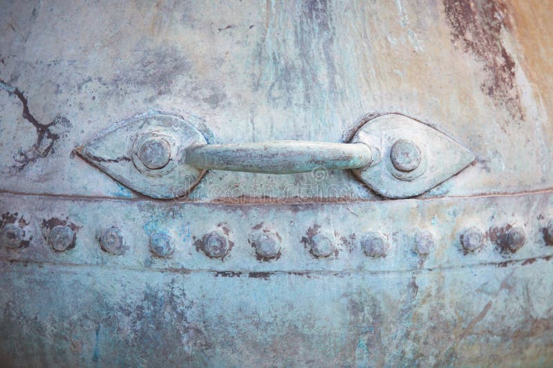 Antique Metallic Pot Handle Detail in Blue and Warm Tone Stock Image