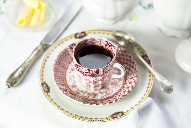 Antique porcelain breakfast setting with black cof royalty free stock images Antique porcelain breakfast setting with black cof royalty free stock images