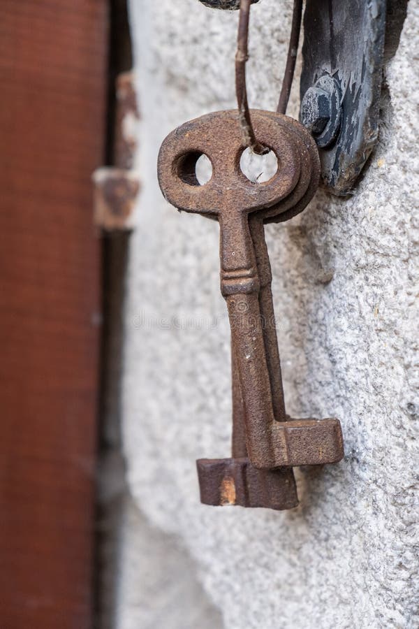 Antique Rusty Iron Keys Hanging on a Granite Wall Stock Image Image