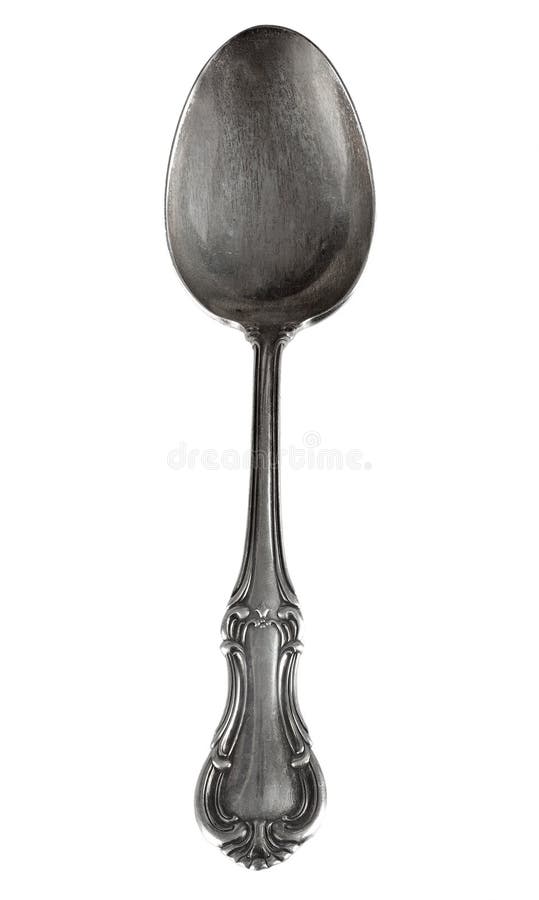 Antique silver spoon isolated on a white background. Antique silver spoon isolated on a white background.