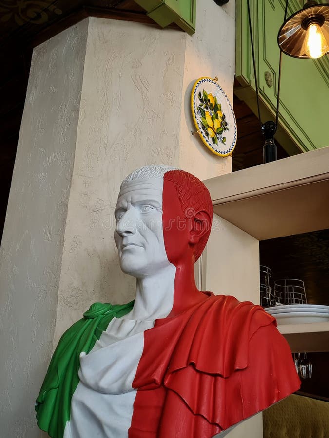 Antique Statue of a Man in the Interior of a Restaurant Stock Image