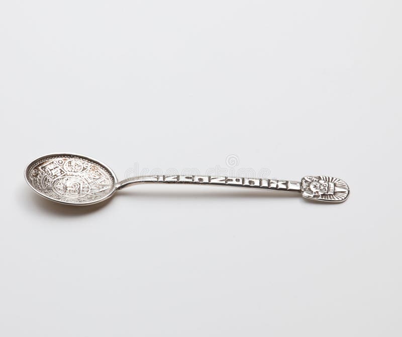 Old fashioned sterling silver object being a decorated mexican spoon from Cancun. Old fashioned sterling silver object being a decorated mexican spoon from Cancun