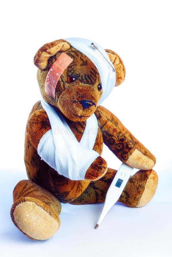 Antique Teddy as Invalider with arm in bandage and a thermometer stock image Antique Teddy as Invalider with arm in bandage and a thermometer stock image