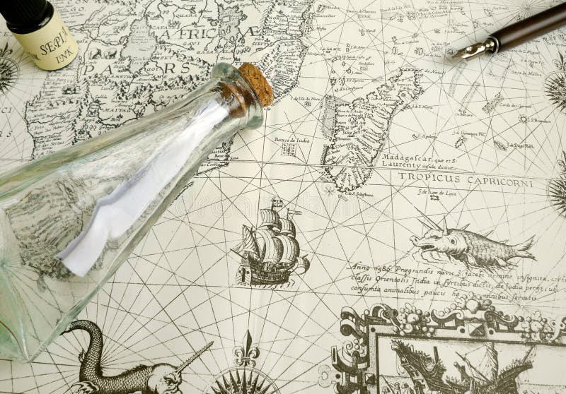 An exotic travels tourism concept photograph of an old ancient map of Africa taken with an antique calligraphic writing pen, a glass bottle with a message inside and bottle of sepia ink. Beautiful details on vintage sailing chart includes old exploring sail ships, weird sea monsters and compass rose. Romantic seafarer trip planning and lost treasure concept. nobody in picture. Exploration and adventurous seafaring journeys themes. An exotic travels tourism concept photograph of an old ancient map of Africa taken with an antique calligraphic writing pen, a glass bottle with a message inside and bottle of sepia ink. Beautiful details on vintage sailing chart includes old exploring sail ships, weird sea monsters and compass rose. Romantic seafarer trip planning and lost treasure concept. nobody in picture. Exploration and adventurous seafaring journeys themes.