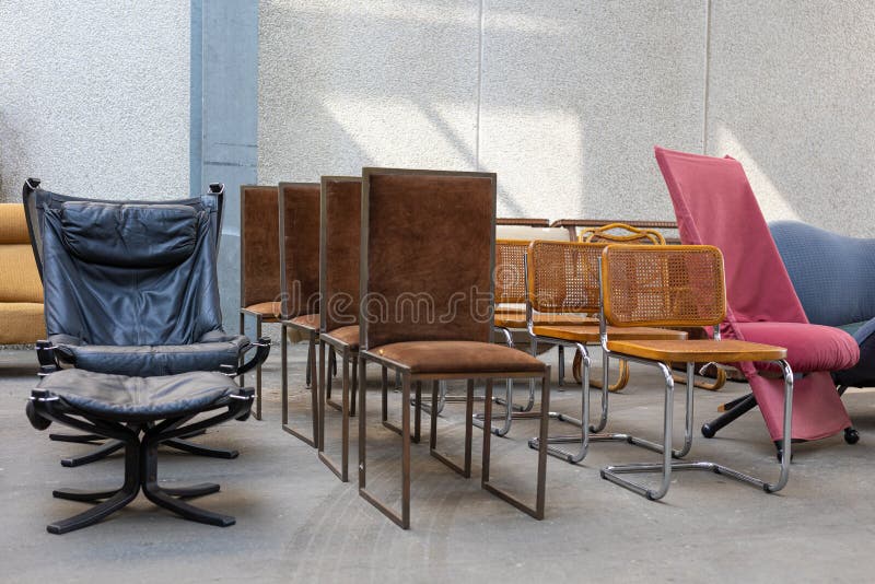 Antique Vintage Chairs in Leather and Other Material Leaning Outside