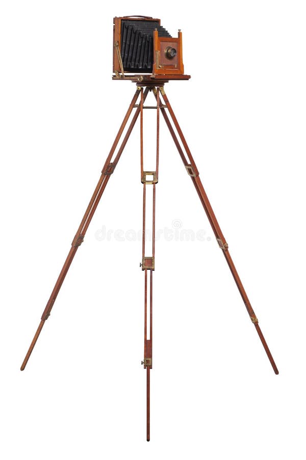 An antique wood camera on an old wooden tripod isolated on white