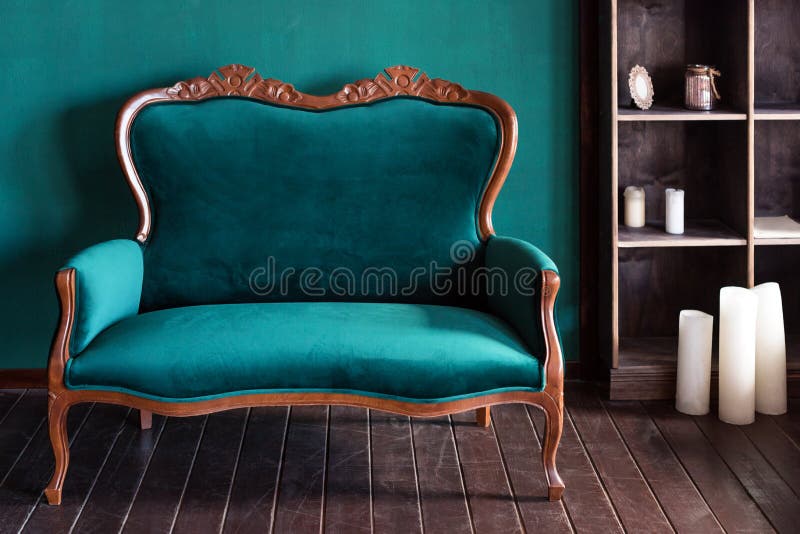 Antique wood sofa couch in vintage room. Classical style armchair.