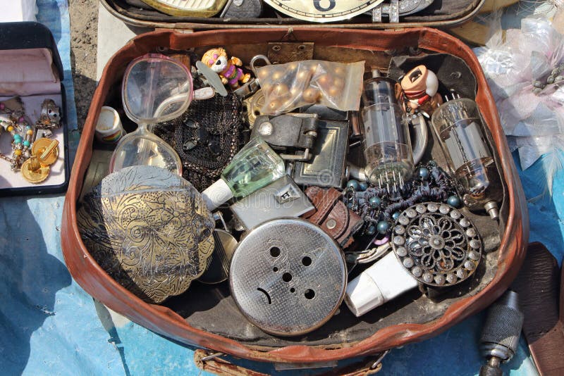 Antiques in the suitcase. Flea market stock photo