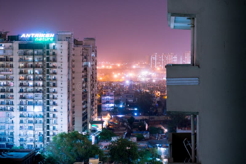 Antriksh Nature apartments in Noida at night. Noida, India - 4th April 2017: Antriksh nature apartment building at night. Apartments are getting very popular stock images Antriksh Nature apartments in Noida at night. Noida, India - 4th April 2017: Antriksh nature apartment building at night. Apartments are getting very popular stock images