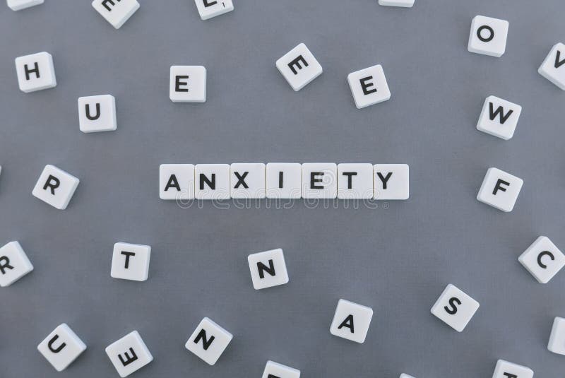 Anxiety word made of square letter word on grey background