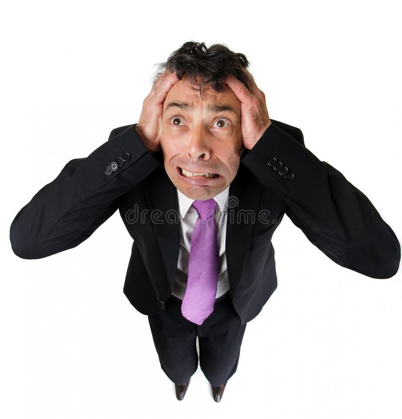 Anxious businessman tearing at his royalty free stock images Anxious businessman tearing at his royalty free stock images