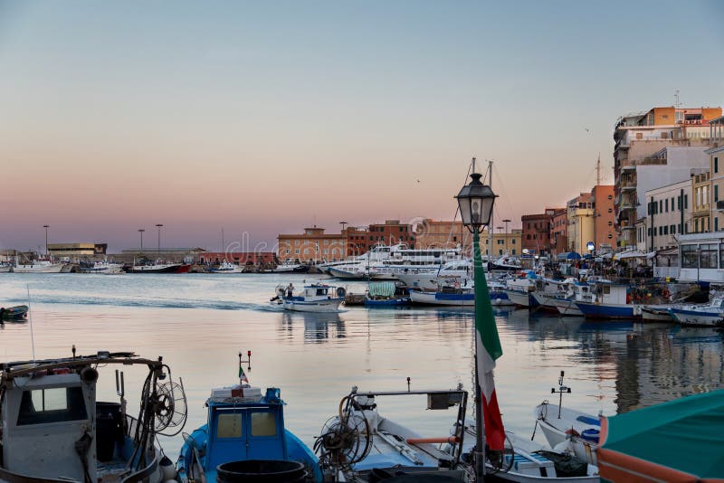 Anzio, Lazio region, Italy - August 27, 2018: Small picturesque city port at sunset