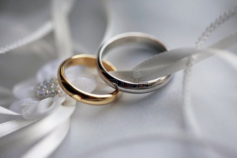 Wedding rings on a satiny fabric. Wedding rings on a satiny fabric