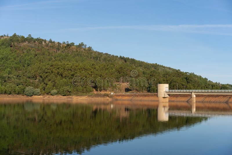 Apartadura dam nature landscape with reflection on the still water in Sao Mamede, Alentejo, Portugal