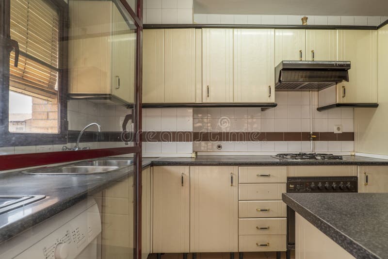 Apartment Kitchen with Beige with Drawers and Doors Stock