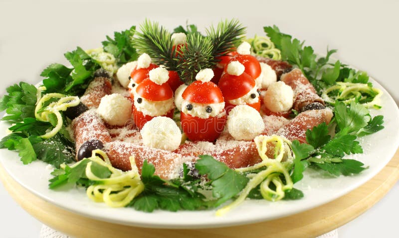 Aperitivo de la Navidad con los tomates de Santa Claus fotografía de archivo Aperitivo de la Navidad con los tomates de Santa Claus fotografía de archivo