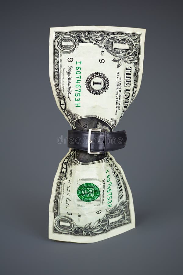 Apertar o cinto no conceito do dólar com orçamento reduzido fotografia de stock royalty free