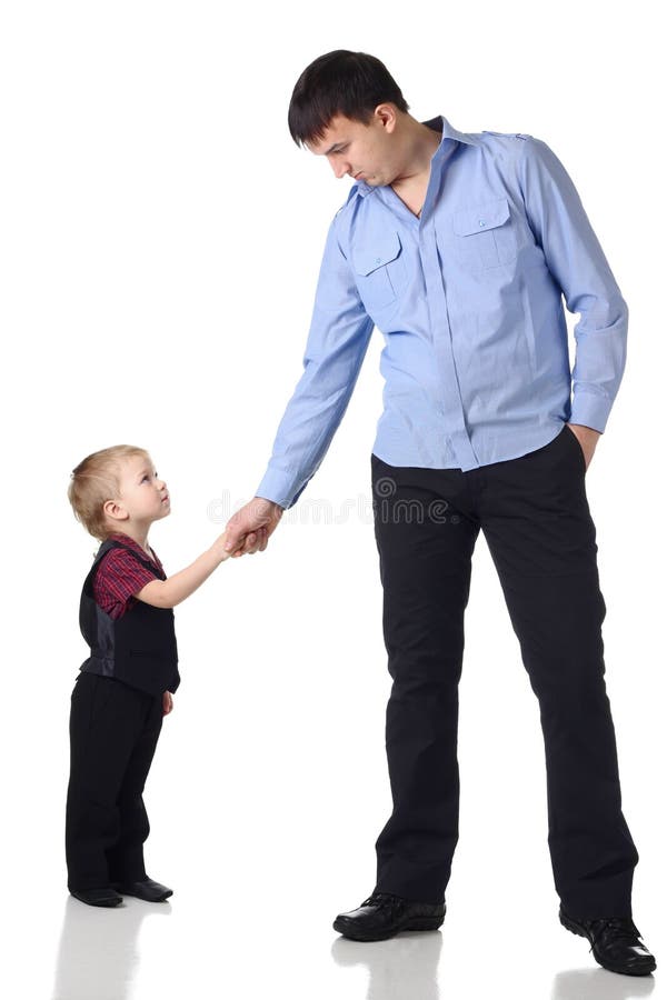 Aperto de mão do homem e do menino fotografia de stock royalty free Aperto de mão do homem e do menino fotografia de stock royalty free