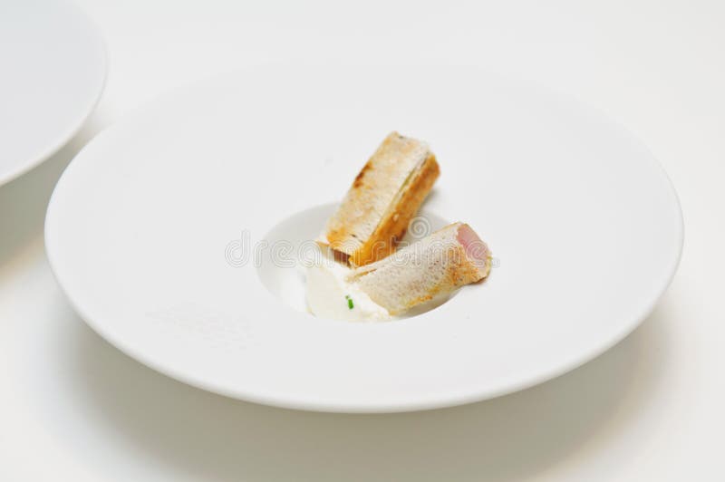 Apetizer of fresh tuna in a tiny slice of bread stock photos