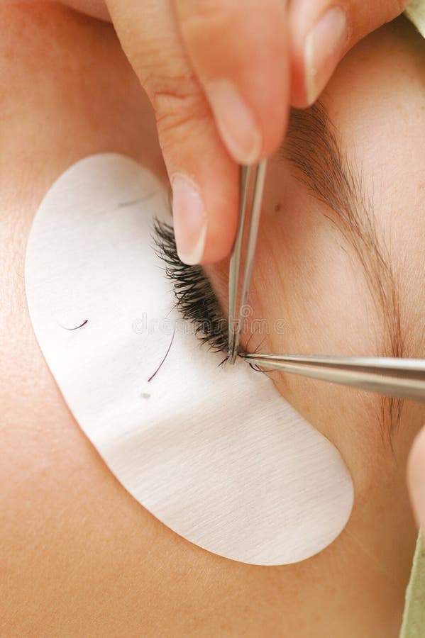 The practitioner applies the new lashes - extends the existing. The practitioner applies the new lashes - extends the existing