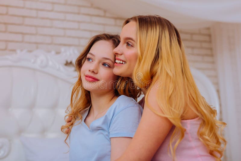 Appealing Teenage Girl Feeling Good Spending Time With Older Sister