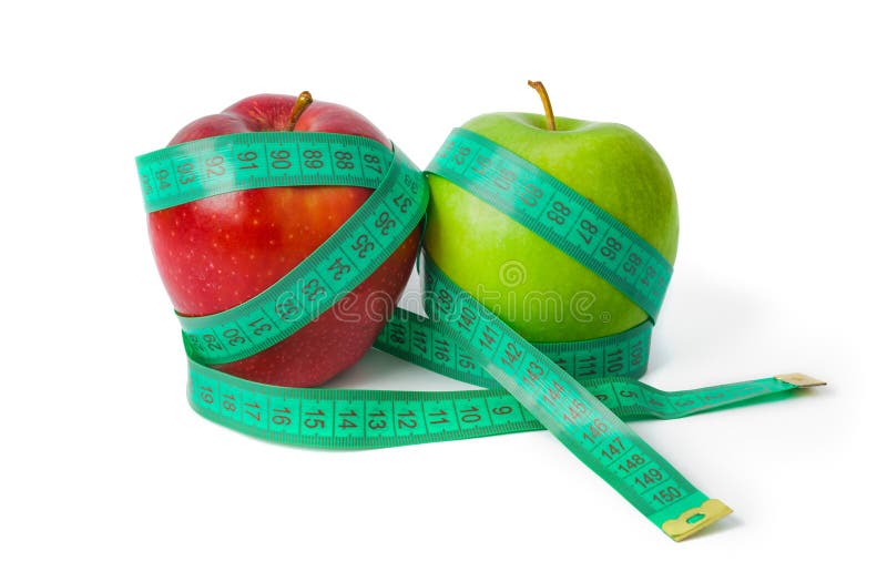 Appelen en meetlint stock afbeeldingen