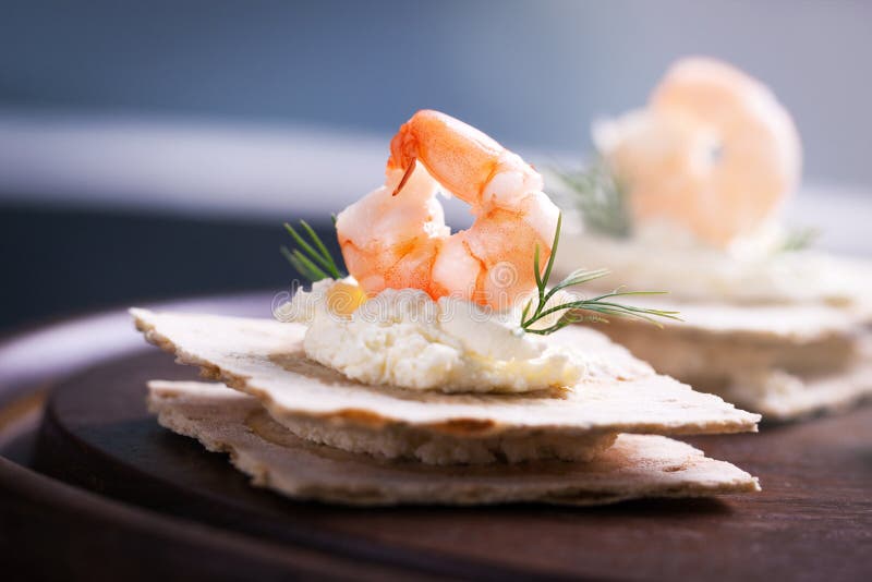 Appetizer Canape with Shrimp, Cheese and Dill on a Small Loaf of Bread