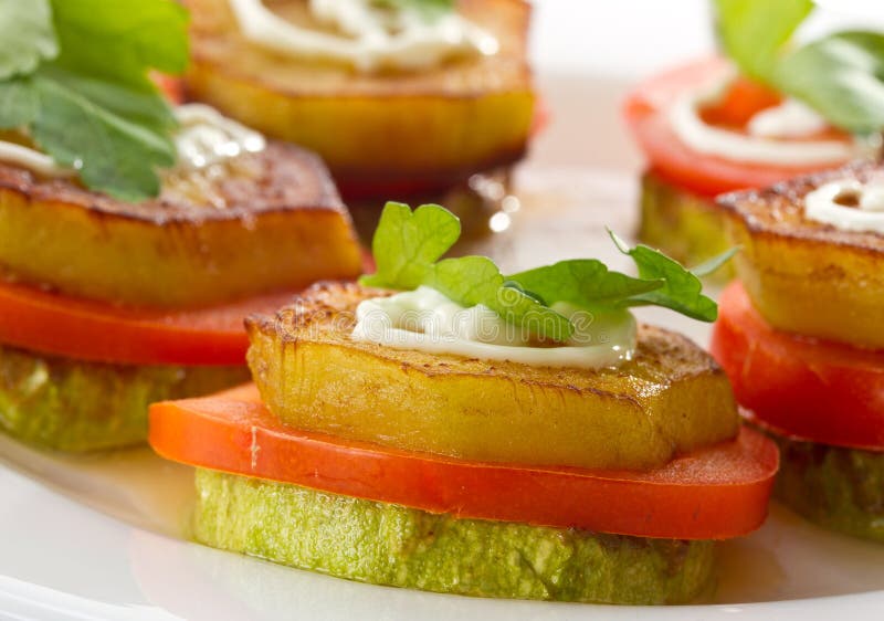 Appetizer of fried zucchini, eggplant and tomato