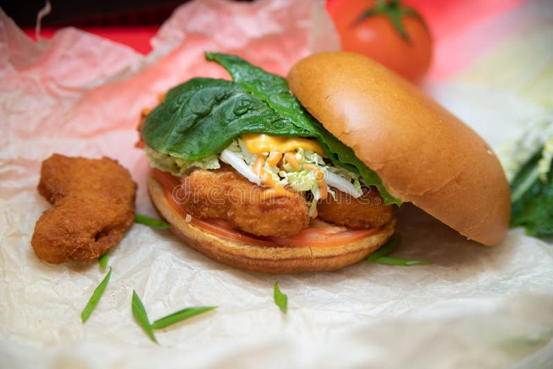 Appetizing Burger with Chicken Nuggets Greens Laid Out on a Dish Stock ...